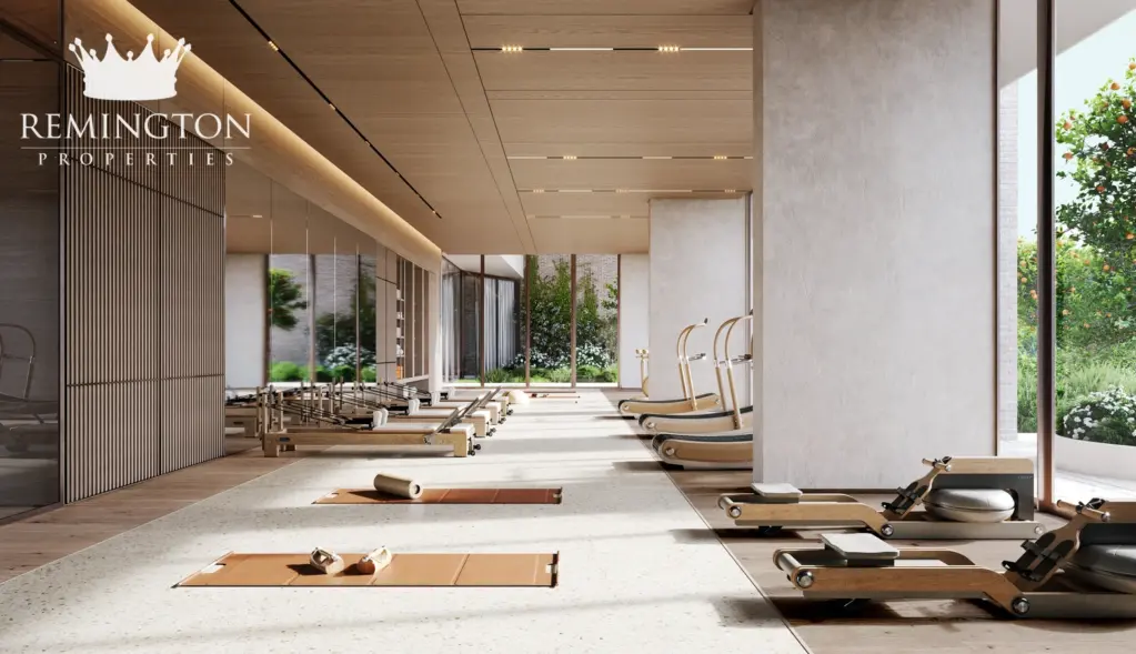 Gym and yoga studio with exercise equipment and treadmills at Arancia Yards 2