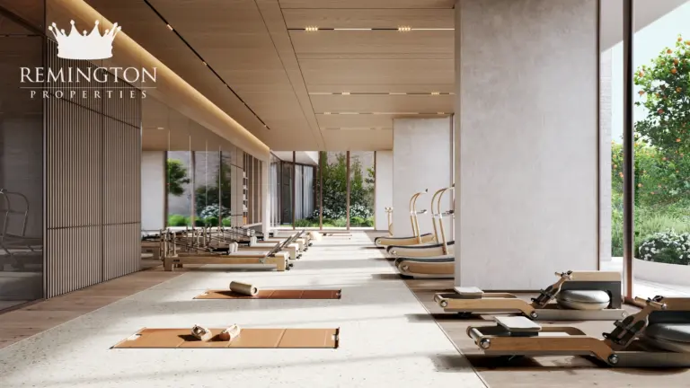 Gym and yoga studio with exercise equipment and treadmills at Arancia Yards 2