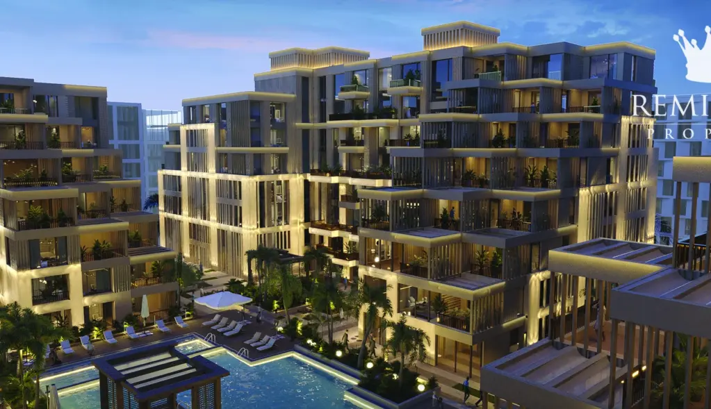 Arisha Terraces low-rise buildings and pool courtyard at night
