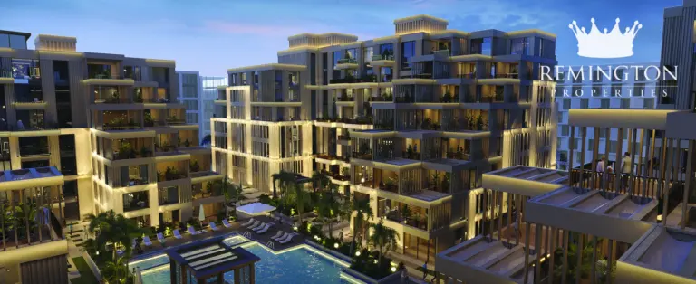 Arisha Terraces low-rise buildings and pool courtyard at night