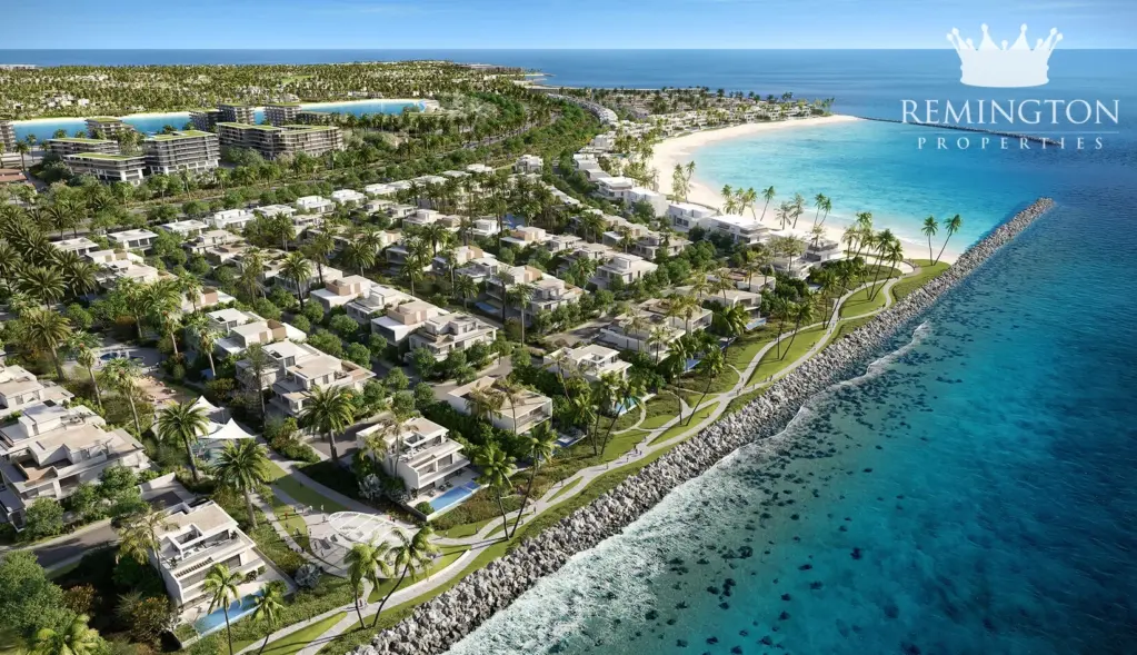 Illustrative aerial view of coastal villas, greenery and beach