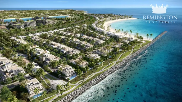 Illustrative aerial view of coastal villas, greenery and beach