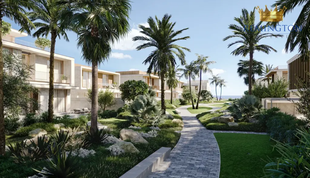 Illustrative landscaped walkway between low-rise homes and palm trees
