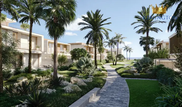 Illustrative landscaped walkway between low-rise homes and palm trees