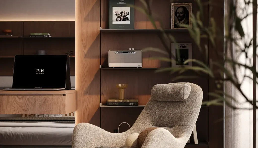 Bedroom reading chair beside the window and built-in shelving