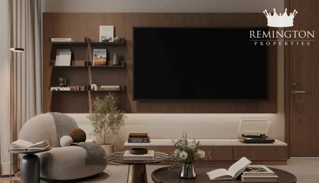 Furnished one-bedroom living room with media wall and reading shelves