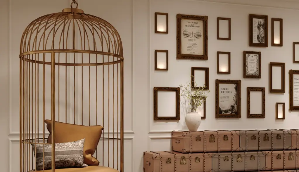 Quiet reading corner with an armchair and wall of framed art