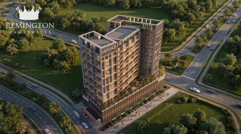 An elevated dusk view of the KORE by Imtiaz tower, roof terraces, trees and surrounding roads.