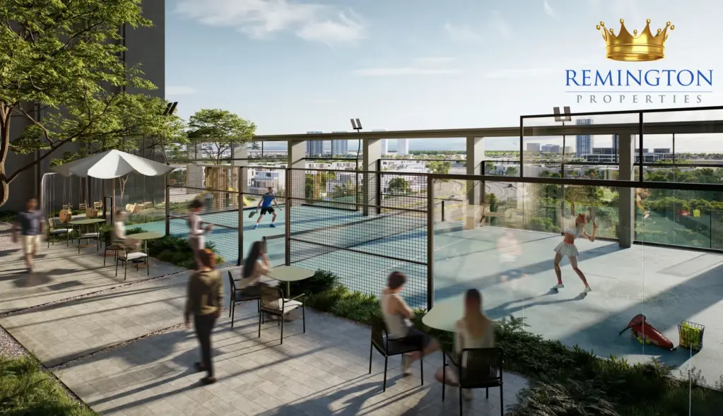 An outdoor padel court at KORE by Imtiaz, with seating and planted terrace areas.