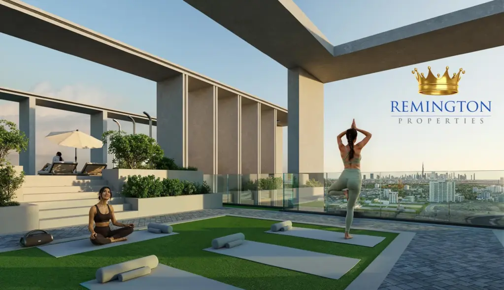 An outdoor exercise terrace at KORE by Imtiaz, with mats, planted borders and shaded seating.