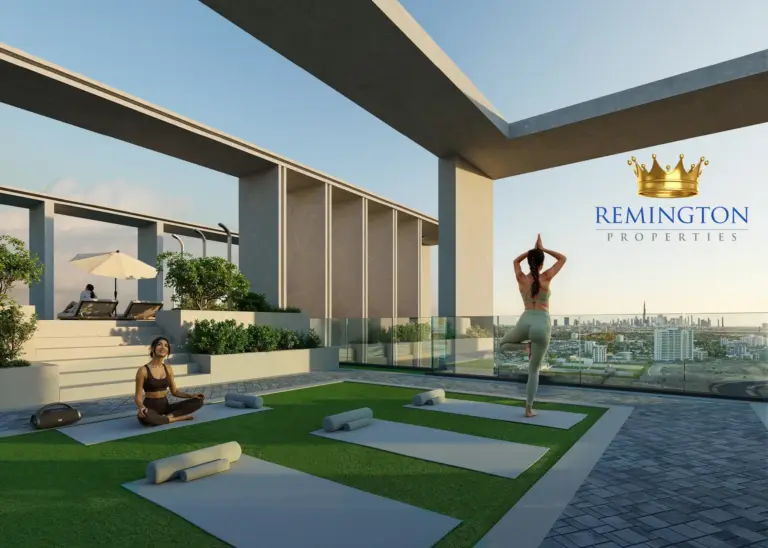 An outdoor exercise terrace at KORE by Imtiaz, with mats, planted borders and shaded seating.