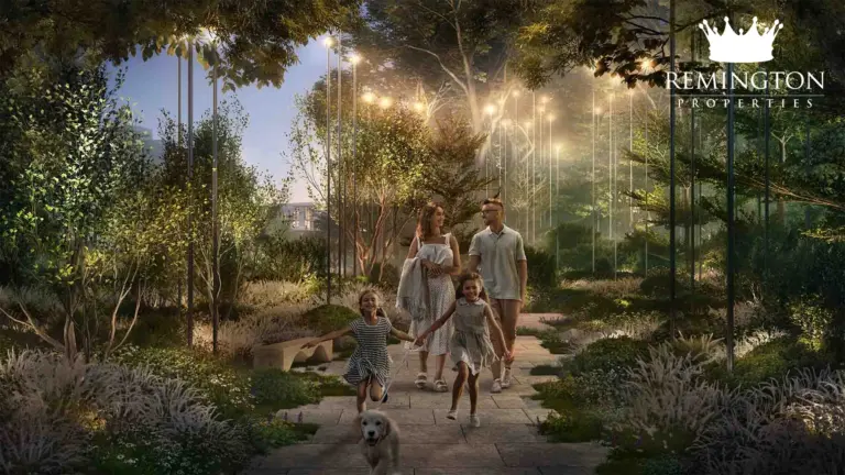 A family walking along an illuminated forest path.