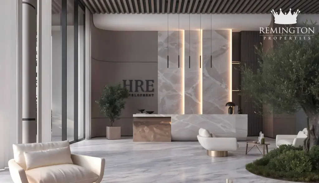 Furnished lobby lounge with sculptural lighting and garden-facing windows