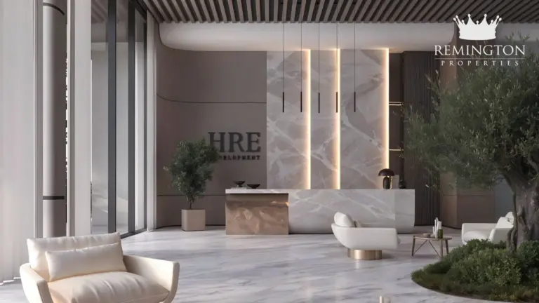 Furnished lobby lounge with sculptural lighting and garden-facing windows