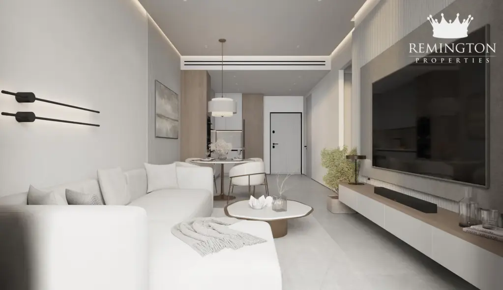 Open-plan one-bedroom living room and dining area at Sakura Gardens