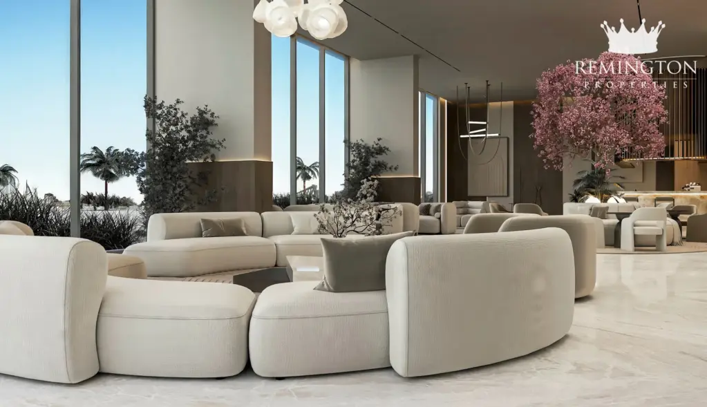 Living room with a curved sofa and views of flowering trees