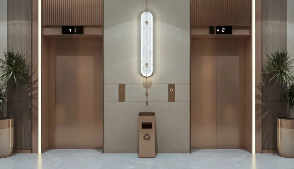 Lift lobby with reflective wall panels and warm lighting