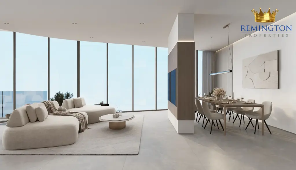 Lounge seating and dining table beside wide windows