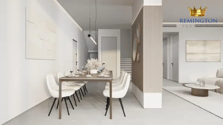 Dining table and open living area in a three-bedroom residence