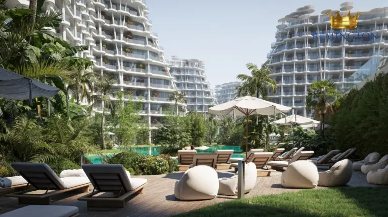Pool loungers and planted terraces between the residential buildings