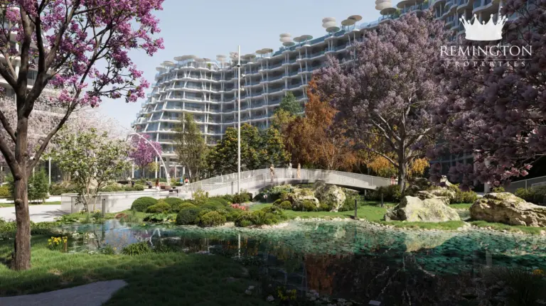 Curving garden path beneath flowering trees beside the residences