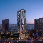 Twilight exterior rendering of the illuminated SAMANA Downtown One tower.