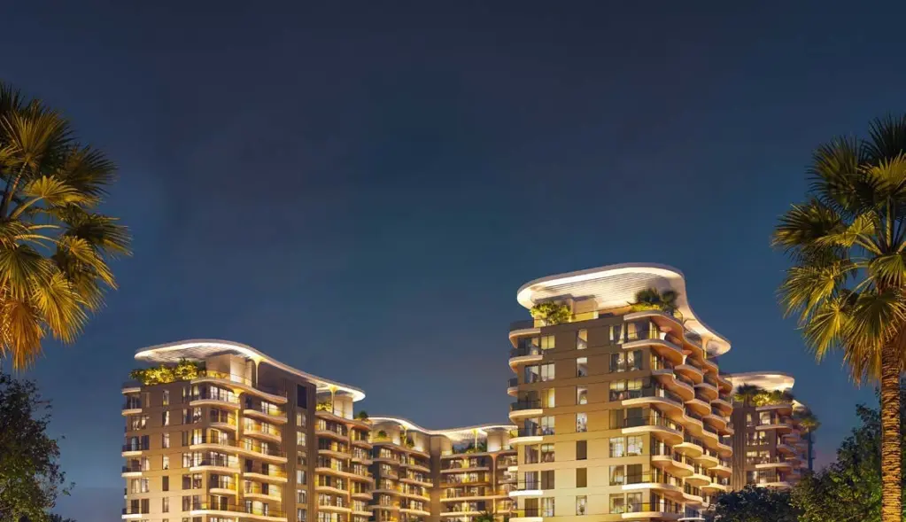Sorrento Lagoon Views by DAMAC: Illuminated residences and landscaped walk at dusk
