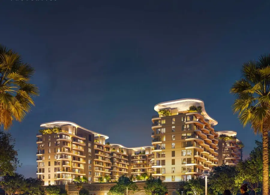 Sorrento Lagoon Views by DAMAC: Illuminated residences and landscaped walk at dusk
