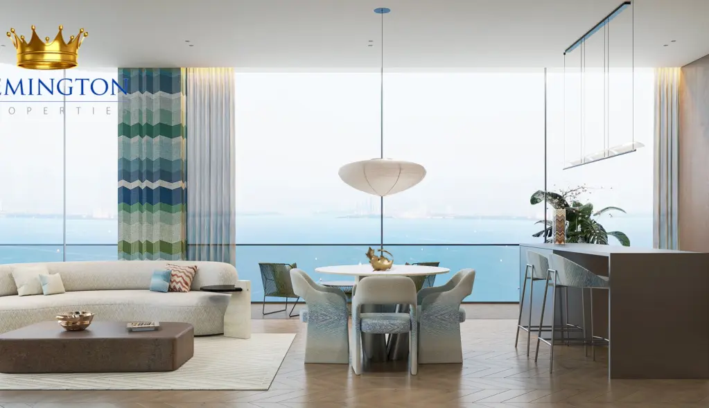 Open-plan living and dining area beside the kitchen, with patterned curtains and waterfront windows