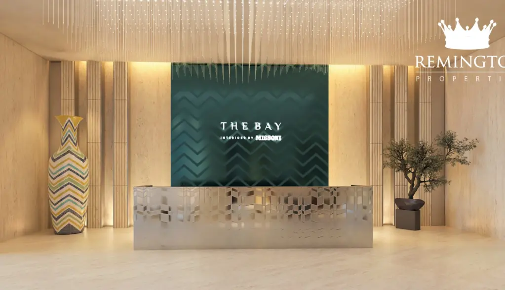The Bay reception desk with patterned wall panels and warm interior finishes