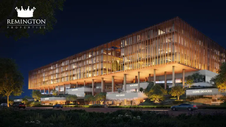 Yards Plaza office building illuminated at night above landscaped pedestrian and arrival areas