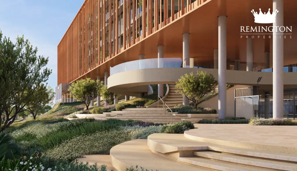 Landscaped paths and curved terrace steps beneath the elevated commercial façade