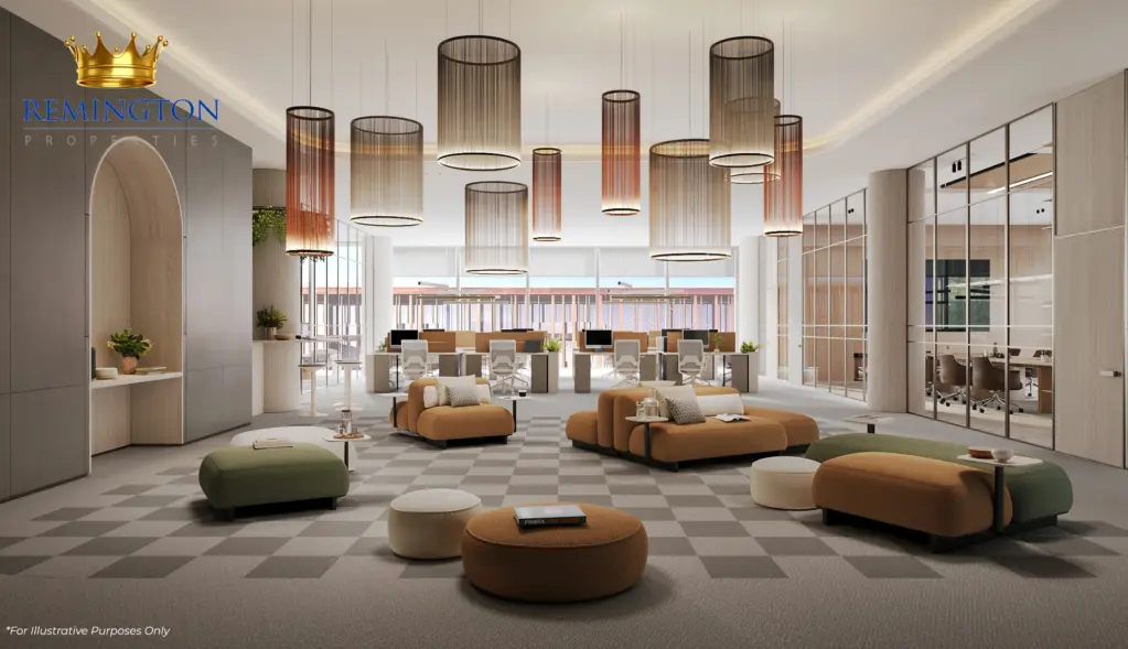 Open-plan office interior with lounge seating, pendant lights and full-height glazing