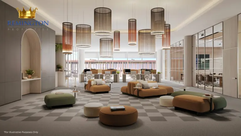 Open-plan office interior with lounge seating, pendant lights and full-height glazing