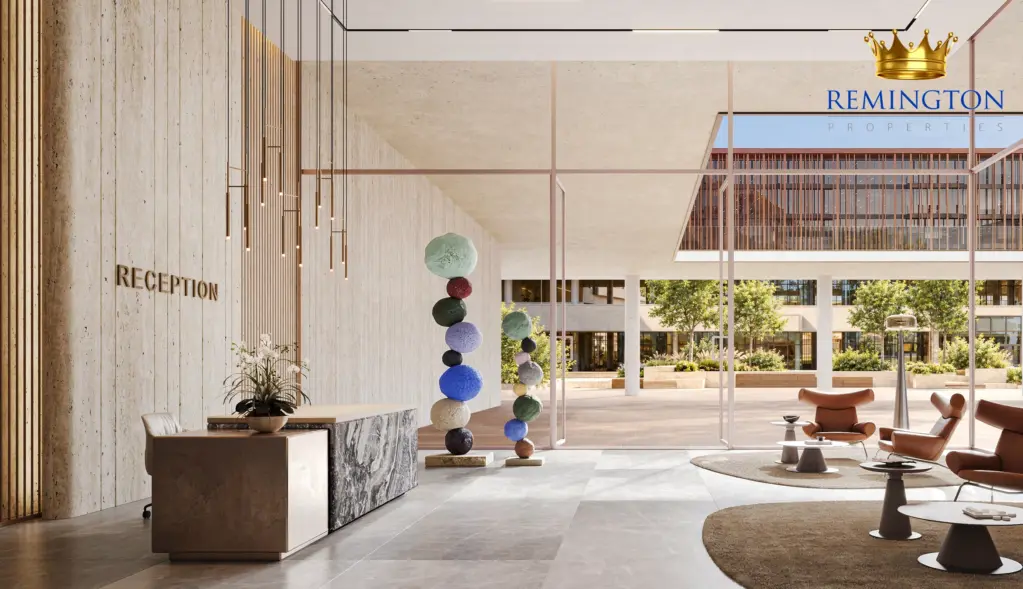 Reception and lounge with a feature artwork, tall windows and views towards the courtyard