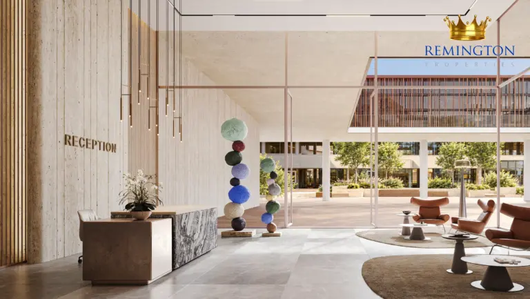 Reception and lounge with a feature artwork, tall windows and views towards the courtyard