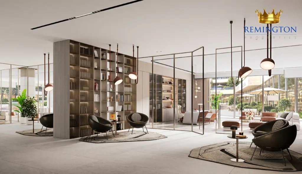 Shared lounge with seating, pendant lights and tall windows overlooking the landscape
