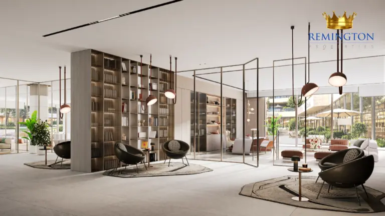 Shared lounge with seating, pendant lights and tall windows overlooking the landscape